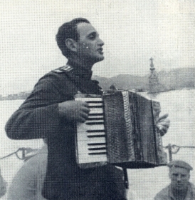 Composer Konstantin Yakovlevich Listov at a party with seamen. 1940s. The photo. (       . 1940- . .) (Belyaev)